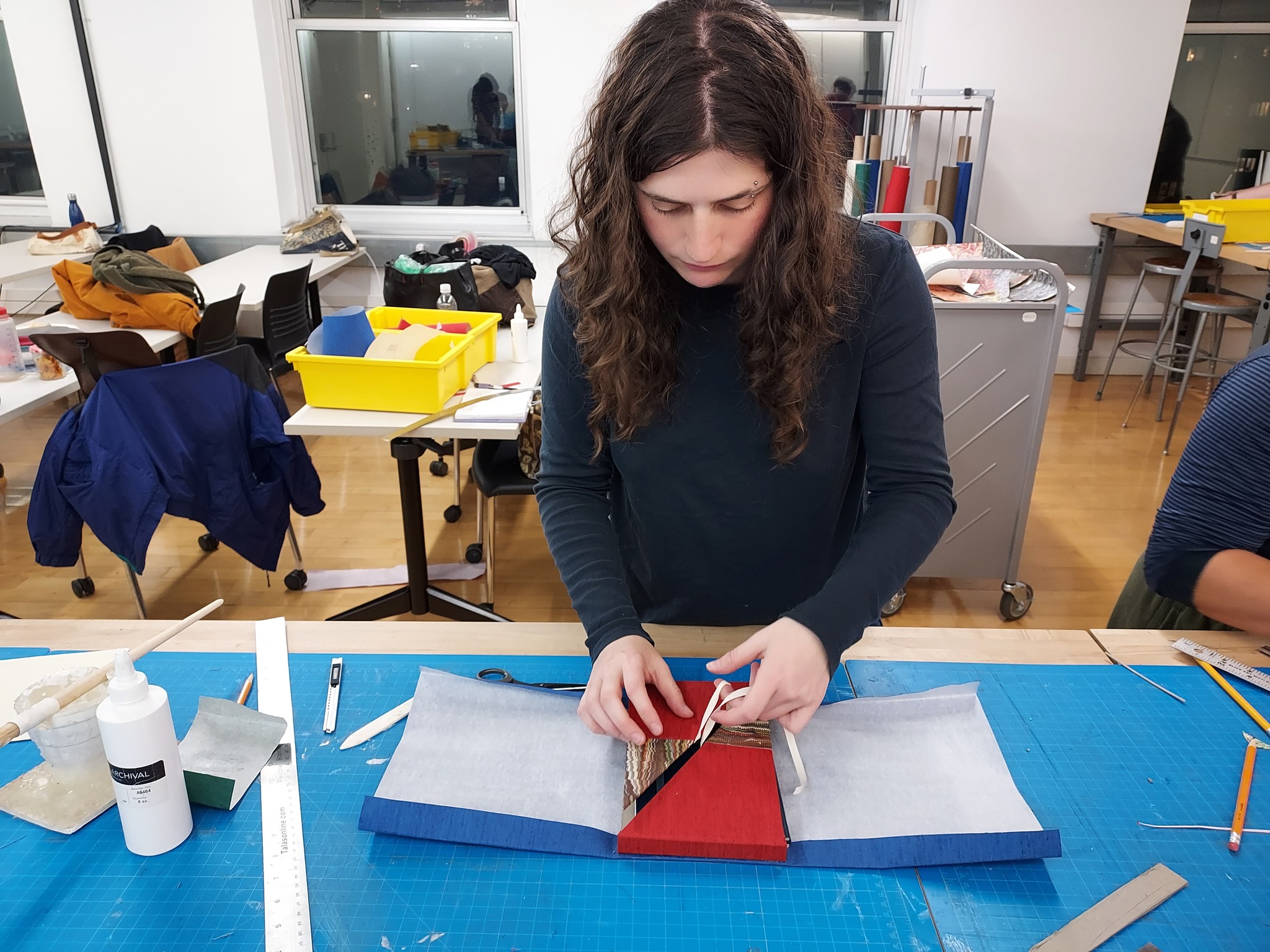 Students in Conservation Lab with Prof. Slava Polishchuk work on custom enclosures for rare books.